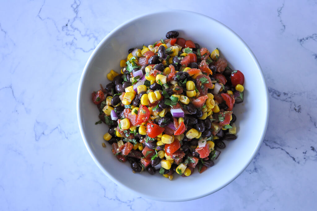 overhead shot of black bean and corn salsa prepared